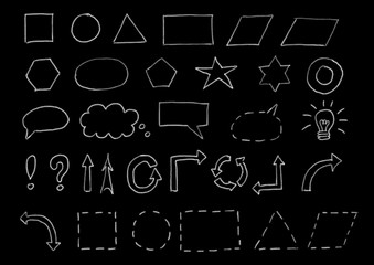 Chalk drawn symbols and shapes on blackboard