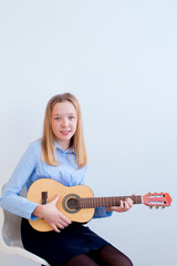 Fototapeta premium Girl playing a guitar