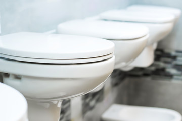 White men urinals in the restroom bathroom close up