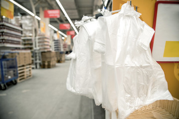 Rack Stand with free plastic bags - cellophane package in the supermarket store. Environmental pollution