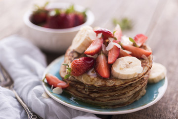 Banana and strawberries pancakes