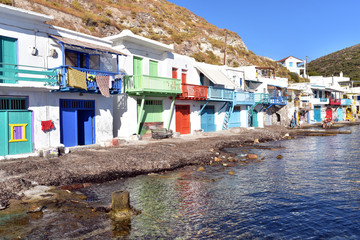 Fototapeta na wymiar Klima, traditional fishing village with multicolored two-storeyed houses in the natural concavities of the rocks. Milos island, Cyclades, Greece