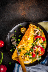 Healthy breakfast food, Stuffed egg omelette with vegetable, dark concrete background copy space...