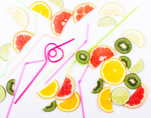 Citrus slices and colored straws for cocktail