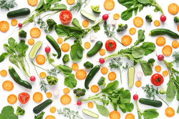 Fresh vegetables and greens on a white background. Pattern of vegetables. Radish, carrots, tomatoes, cucumbers, dill isolated on white background. Vegetable background wallpaper.Top view, flat lay.