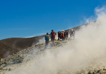 Tourists on top of the volcano of the Aeolian island Vulcano, Sicily
