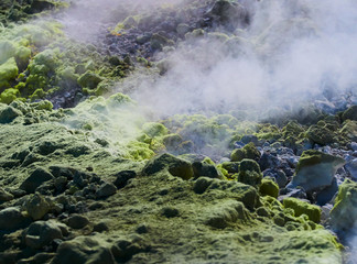 Sulphur gas coming out of the edge of the volcanic crater on the Vulcano island in the Aeolian islands, Sicily, Italy
