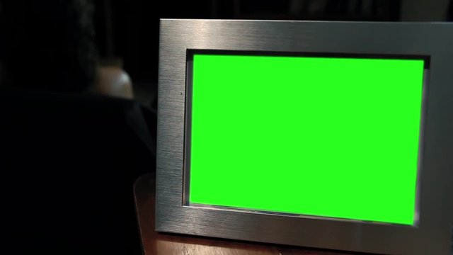 Photo Frame Green Screen in the Dark. Zoom Out. You can replace green screen with the footage or picture you want with “Keying” effect in After Effects  (check out tutorials on YouTube). 