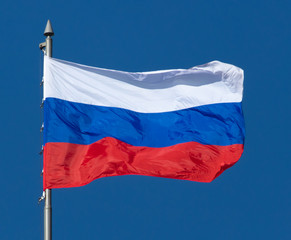 Fototapeta na wymiar Flag of the Russian Federation against the blue sky