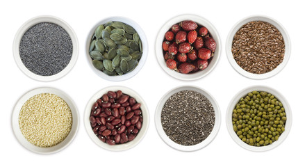 Set of superfood isolated on white background. Superfood with copy space for text. Seeds of flax, poppies, beans, mung beans, chia, sesame, rosehip, pumpkin seeds. Top view. Seeds in a bowl