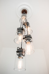 Exposed string hanging light bulbs