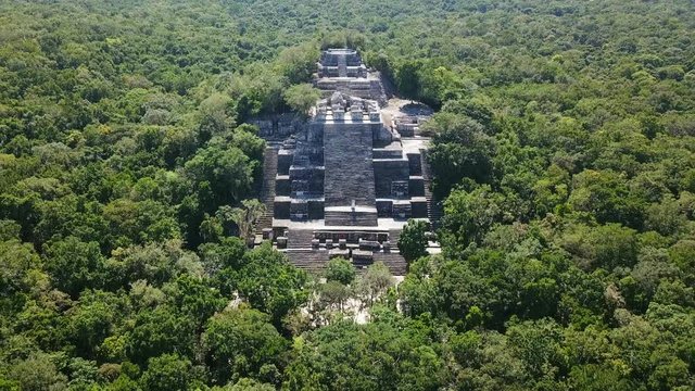 Aerial video flying towards the mayan Calakmul Temple in the Mexican Yucatan. The mayan ruins at Calakmul, Mexico