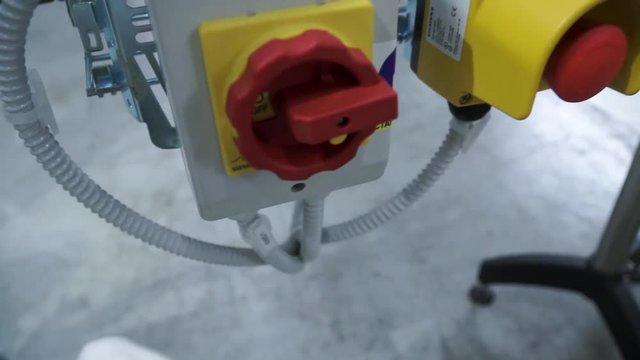 Hand in glove pressing button - starting industrial process. Clip. Worker presses the button at the factory