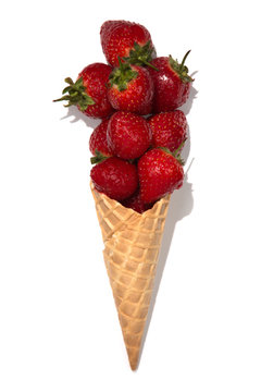 Ice cream cone with strawberry on white isolated background.