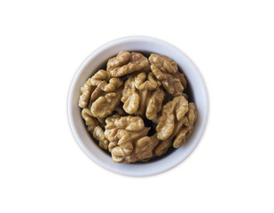 Kernels walnuts isolated on white. Walnuts in a bowl isolated on white background. Top view. Walnuts with copy space for text on a white background