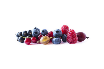 Fruits and berries isolated on white background. Ripe currants, blueberries, raspberries and gooseberries. Top view.