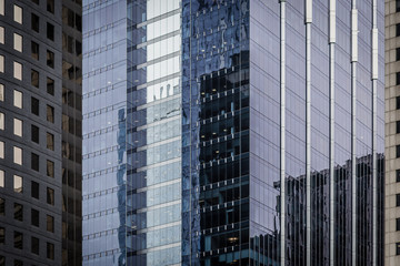 Fototapeta premium Close up of glass buildings