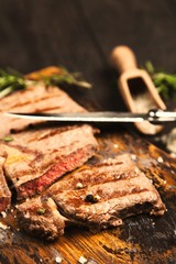 Grilled steak on wooden cutting board