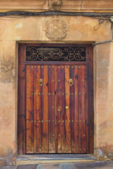 Old door in a street of Ronda. Andalucia