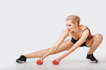 woman in sportswear does exercises