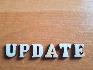 The word 'update' made of wooden letters. wood inscription