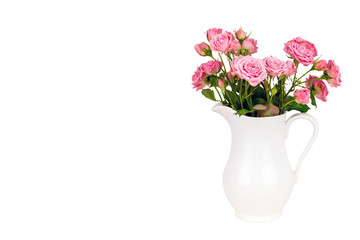 Naklejka na ściany i meble Pink flowers in white jug.