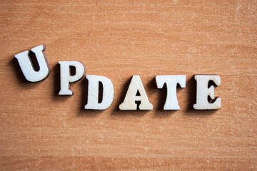 The word 'update' made of wooden letters. wood inscription