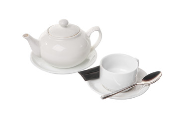 A white kettle, a teapot on a plate, an empty cup, a tea pair, without liquid, two black bags, a dose of sugar, a teaspoon. For the technological map. Side view from above Isolated white background