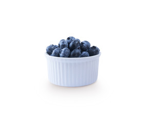 Blueberries in a bowl isolated on white. Ripe blueberries with copy space for text. Blueberries basil on a white background.