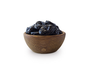 Dried prunes isolated on a white background. Dried prunes in a bowl on white background. Dried prunes with copy space for text.