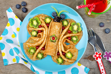 Funny Butterfly face pancakes with berries and fruits for kids' snack food
