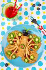 Funny Butterfly face pancakes with berries and fruits for kids' snack food