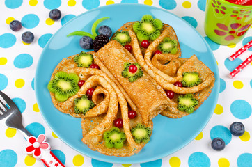 Funny Butterfly face pancakes with berries and fruits for kids' snack food
