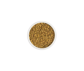 Fenugreek with seeds in a bowl. Fenugreek seeds isolated on white background. Top view.