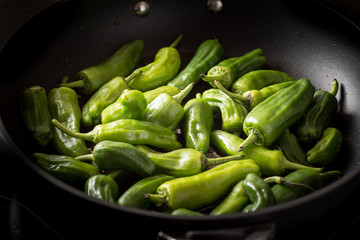 Green Padron Peppers in the Frying Pan. Pimientos de Padron.