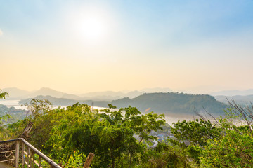 Top view of Luang Prabang City with clear sky and sunshine from high mountain at Phousi Hill, Luang Prabang, Laos.