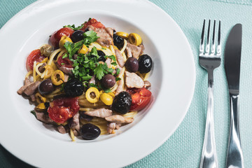 Spaghetti with Mediterranean tuna, capers, olives, Sicilian chilli pepper, cherry tomatoes and a sprinkling of parsley