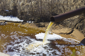 The Industrial Wastewater is Discharged from the Pipe