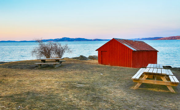 The view of the Trondheim fjord from the path Ladestien in the norwegian city Trondheim. Spring sunset.