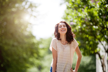 Beautiful smiling girl with eyes closed - close up