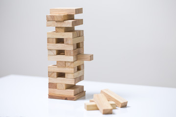 Business risk concept with wood jenga game.