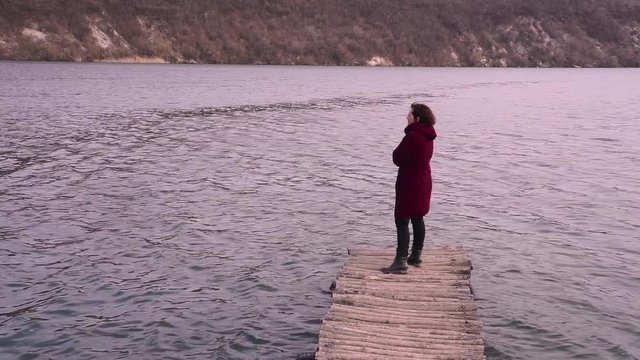 Woman on a old bridge and looking at her