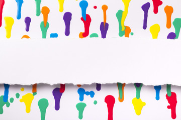 painted abstract background, strip of white paper with torn edges with a place