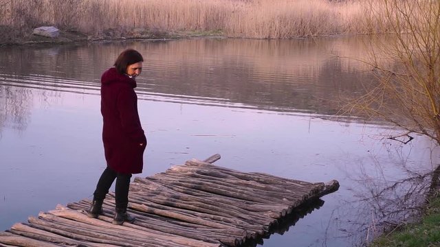 Woman on a old bridge and looking at her