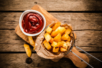 French fries on wooden table