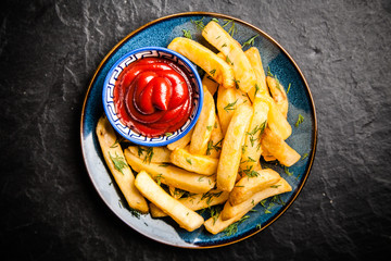 French fries on wooden table
