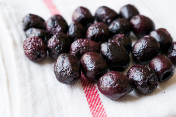 Dried Black Olive Chips / Crackers without seeds in Bowl.