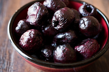 Dried Black Olive Chips / Crackers without seeds in Bowl.