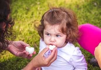child with an easter egg in the park