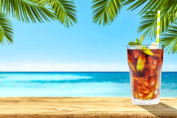 Summer drink on desk and sea landscape 
